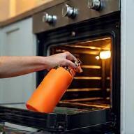 Sterling Cleaners degreasing an oven in a Manchester family kitchen
